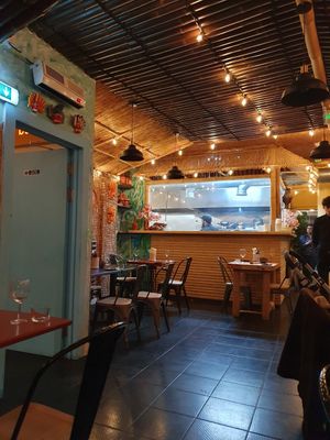 View of kitchen from dining room at Machan Kitchen in London