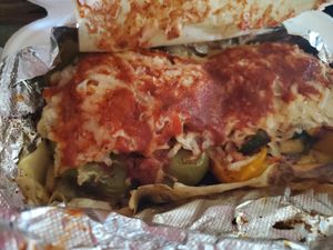 VEGAN STUFFED PEPPER - Stuffed Bell Pepper with brown rice and quinoa, red sauce, squash, black beans, and zucchini, and your choice of cheese. (used vegan mozzarella) at The Detroit Pepper Company in Detroit