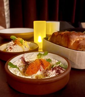 Taramasalata, whipped ricotta, layered herb bread  at Anixi in New York City