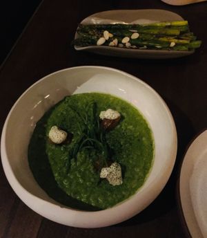 Arak cured “salmon” risotto with a side of grilled asparagus. at Anixi in New York City
