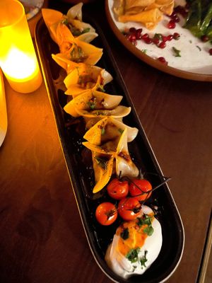MANTI "LAMB" POCKETS - Tomato confit, brown butter, yogurt, sumac, lemon, parsley

 at Anixi in New York City