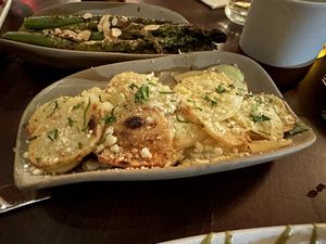 Sides of mustard almond asparagus and lemon potatoes  at Anixi in New York City