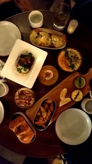 Everything we ordered: 3 dip Mezze with layered herb bread, artichoke tots, beef dolmas and confit potatoes everything delicious favs were the dolmas, ricotta and eggplant dips and at Anixi in New York City