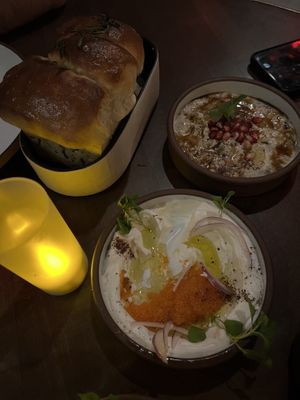 Taramasalata (closest), fire roasted eggplant & layered herb bread  at Anixi in New York City