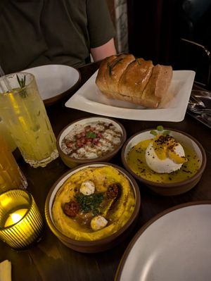 Different mezzes (dips) with layered bread at Anixi in New York City