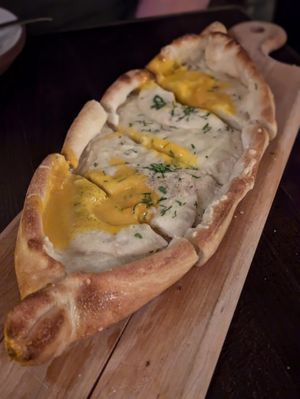 Egg and mozzarella flatbread pizza at Anixi in New York City
