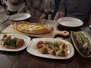 Khachapuri (rear), Kibbeh (left), Manti (center), and asparagus (right)  at Anixi in New York City