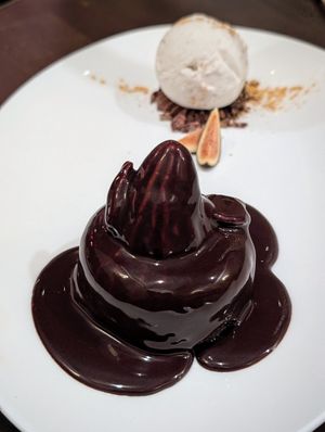 Lava date cake covered in dark chocolate at Anixi in New York City