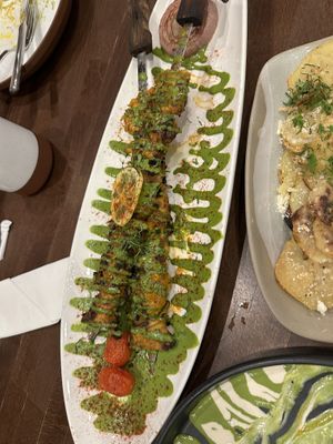 Chicken kabobs and confit potatoes  at Anixi in New York City