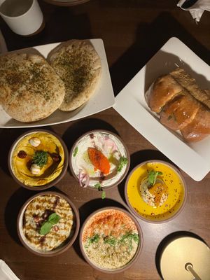 All 5 dip mezze with za'atar pita and layered herb bread at Anixi in New York City