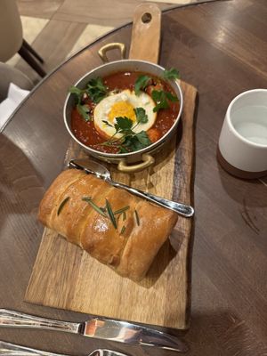 Off the specials brunch menu - spicy something with fried egg and fresh bread    at Anixi in New York City