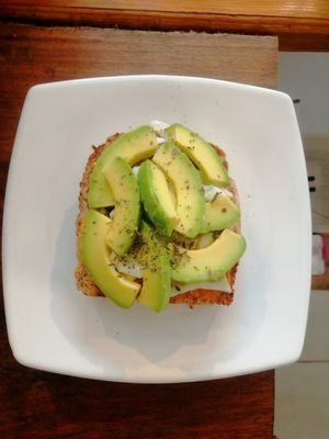 Tostada de masa madre salsa de la casa. Pepino y aguacate at La Sierrita in Palomino