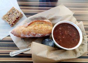 Black bean soup, half baguette and strawberry crumble bar 😋 at The Pig and the Plow Farmstead Bakery in Fort Collins