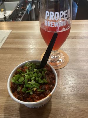 Vegan chili and a glass of sour ale 🍺.  at Proper Brewing & Burger Co in Moab