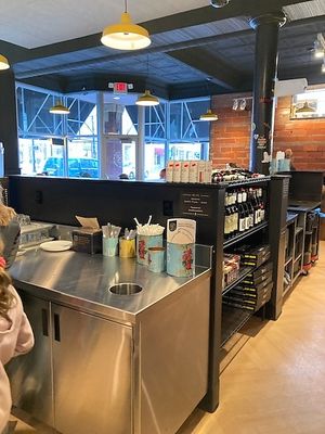 Self-service station for cutlery, paper plates, take home boxes  at Boom's Pizza in Lakewood
