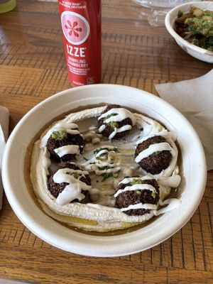Hummus bowl with falafel and strawberry Izze  at Aladdin in Stowe