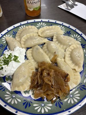 Potato and mushrooms dumpings — forgot to ask without cream, but at least it was easy to keep aside!  at Vareniks in Haifa