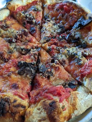 Pizza with vegan cheese at Prodigy Brewing in Logan