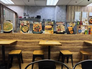 Signs near the prep area and tables   at Seva Cafe in Central Singapore