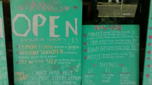 The portion of the Sissy's outdoor menu boards showing drinks (left) and salads (right). Picture taken March 2021. at Sissy's Cafe in Kingston