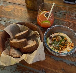 Hummus, confit garlic, sourdough bread  at Madhouse in Budapest