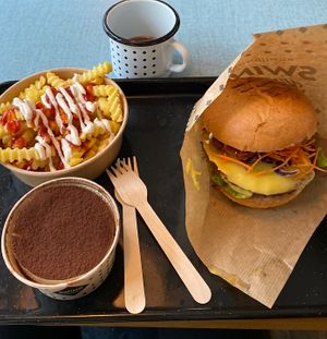 menu with cheese burger, fries, a refillable drink and an additional tiramisu   at Swing Kitchen in Munich