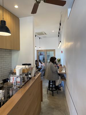 bar counter with few seats to eat inside   at Cafe Stand Blossom in Kamakura