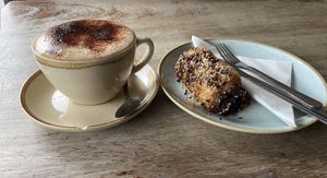 vegan saussage roll and almond cappuccino  at Boulangerie Jade in South East London