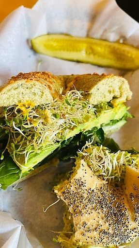 made to order bagel with avocado, sprouts, lettuce and spinach at Ozark Mountain Bagel Co - Central Ave in Bentonville