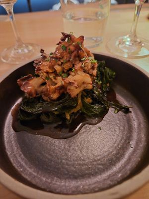 Roasted maitake mushroom with greens and celeriac puree. It ate very steak dinner esque at Astera in Portland