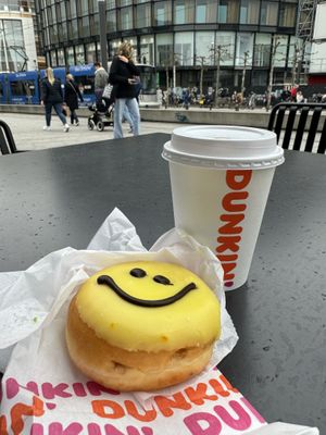 Tea with oat milk and smiley vegan doughnut 🙂  at Dunkin' - Gustaf-Gründgens-Platz in Dusseldorf
