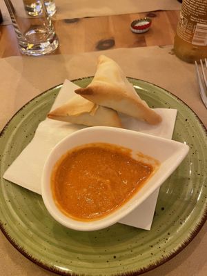 Vegan samosas with a tomato & peanut saucee  at Zigni Ristorante Eritreo in Verona