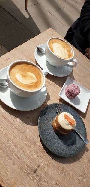 Hot chocolate, carrot cake, macaron at ima vegan  in Hamburg