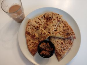 Aloo paratha (vegan) and oat milk masala chai at INDelicious Bistro in Prague