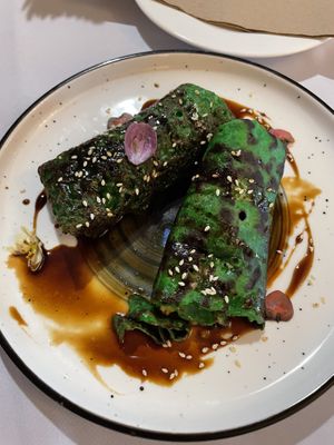 Green dessert crêpes filled with cooked plantain in a peanut butter and coconut filling  at KANU By Lance Seeto in Suva