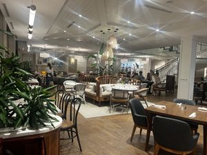 Indoor lobby restaurant seating and upstairs roof top dining  at Delish Sisters in Clemson