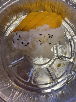 half eaten (but super delicious!) mango sticky rice   at Plumeria in San Diego