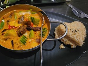 Pumpkin Red Curry with vegan duck and brown rice. at Plumeria in San Diego