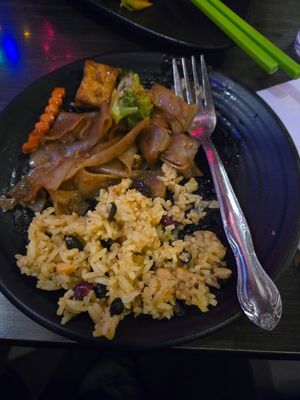 Curry fried rice and noodle dish 😋 at Plumeria in San Diego
