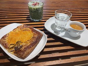 French onion danish with oat milk iced dairy duster matcha and house blend espresso   at Presta Coffee Roasters in Tucson