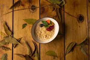 Vegan oatmeal: oatmeal, peanut butter, banana, vegetable milk, berry mix at TUF Club in Yerevan