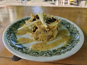 Artichoke and potato tartar in mustard vinaigrette with pea sprouts at Bagatelle Bistro im Palmengarten in Cologne