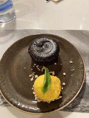 Vegan chocolate cake with mango ice cream  at UDON - Viapol in Sevilla