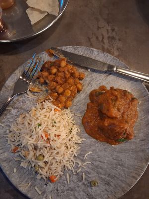 Veg pilau rice, chickpea curry, potato curry at KO Grill in Liverpool