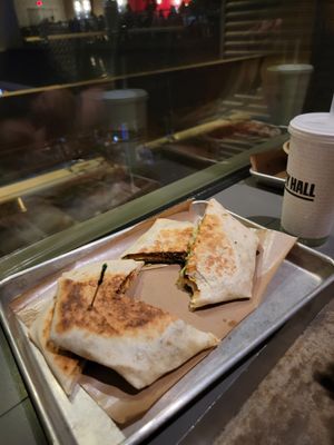 Crunch wraps, sitting on the floor. at Vegan Vibrationz in Plano