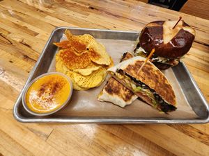 Black bean crunch wrap, bacon jalapeño cheddar burger, chips and queso at Vegan Vibrationz in Plano