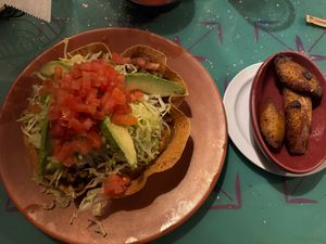 Taco salad with a side of fried plantains  at Lupita's Cantina in Perrysburg