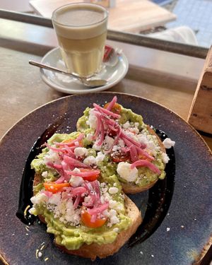 avocado ‘feta’ toast & turmeric latte  at Velo Cafe & Bar in Interlaken