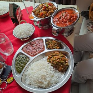 Top left: vegan Aloo Gobi (potatoes cauliflower  curry)- our favorite. Top right: spicey Soya Rara (soy meat) - very firy & good. Center: vegetable thali in vegan (several currie) at Manakamana in Cheb