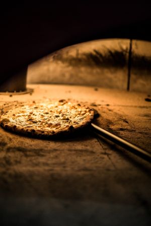 Get ready to feast your eyes on the mouth-watering sight of our vegetarian and vegan pizza cooking to perfection in our traditional wood-fired style oven at Papa G's Pizzeria in Blacktown